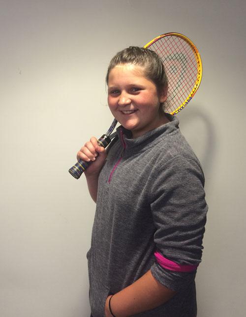 Girl holding tennis racket
