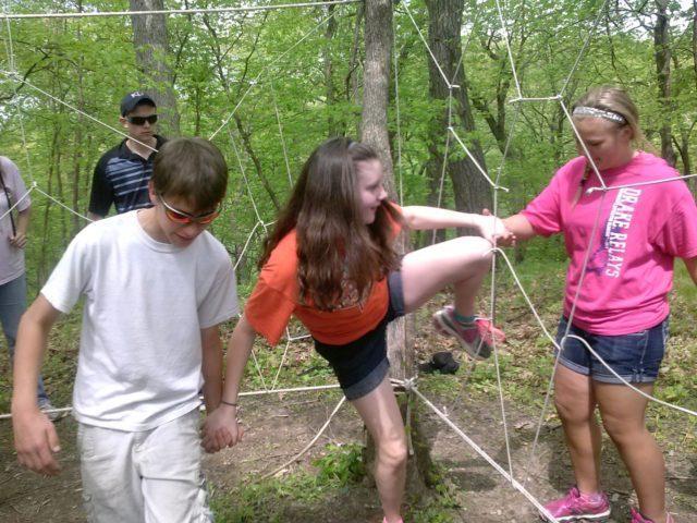 Group working through ropes course