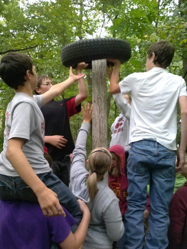 Group with tire on a post