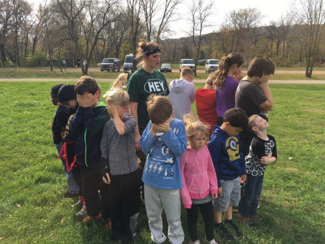 Group of kids in Circle with eyes closed